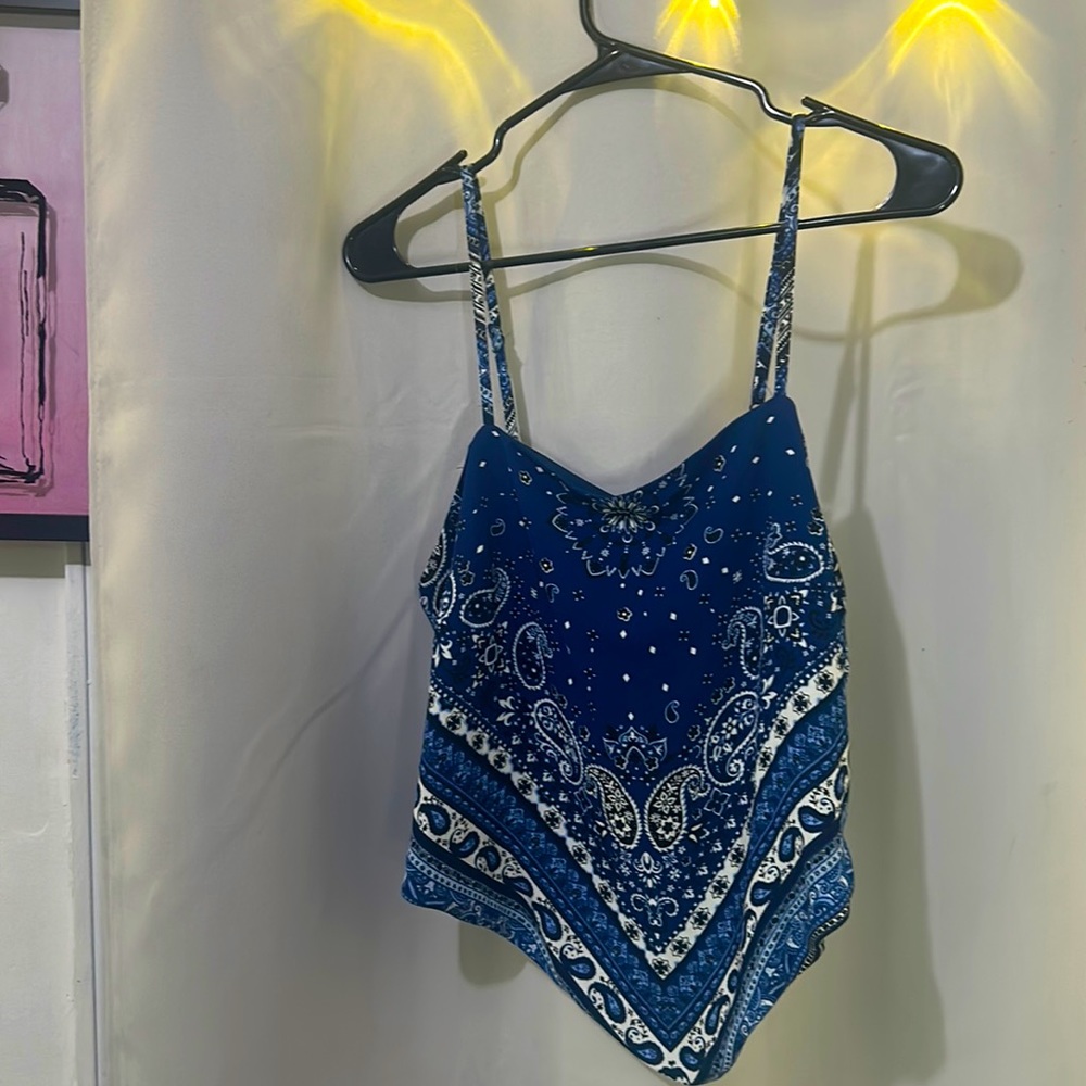 Tank top gets tied in the back.